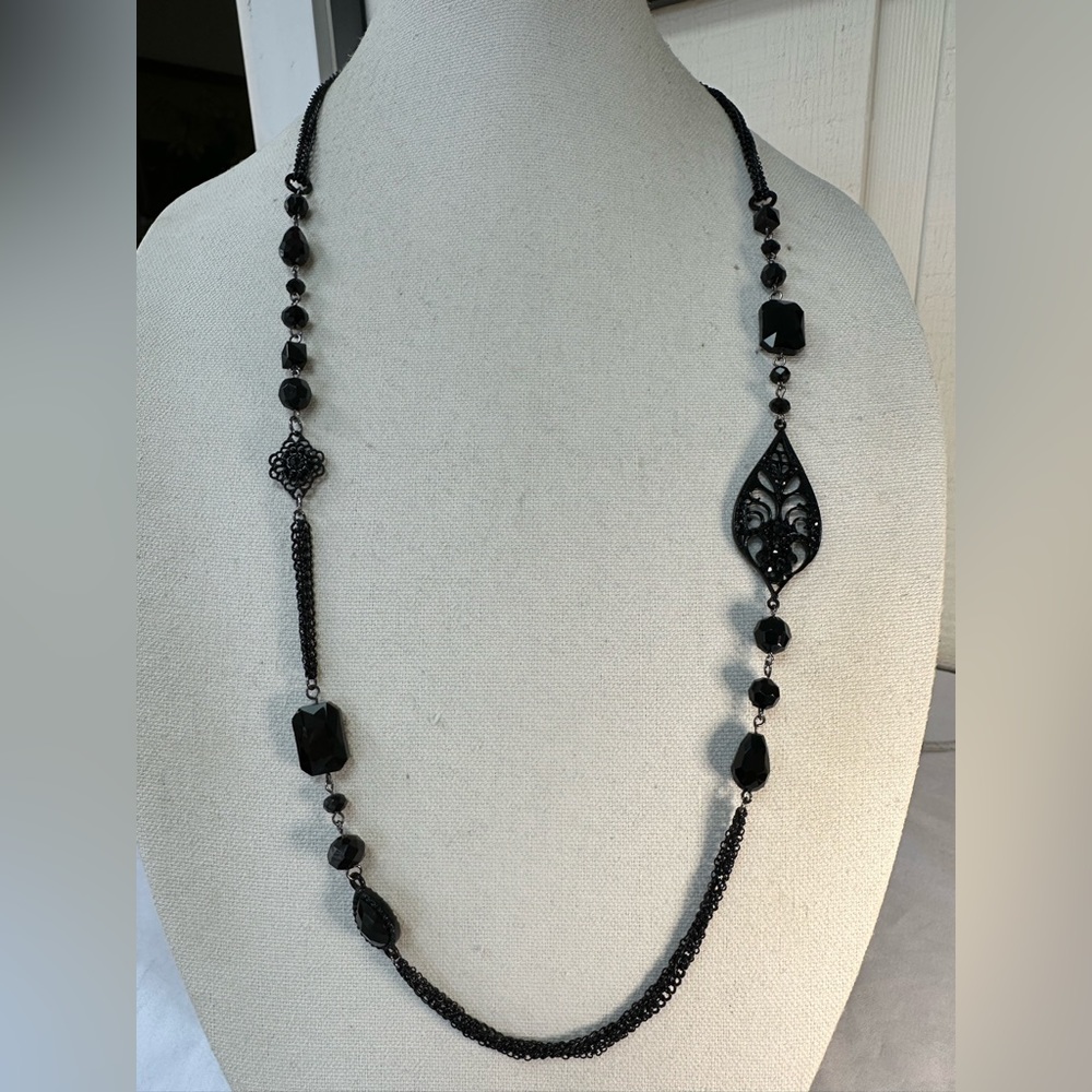Long black chain necklace with black accents and rhinestones